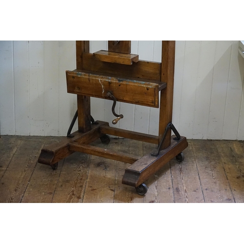 553 - A Large Late 19th Century Chestnut Easel with winding mechanism, Block rest & Thumb Piece. Measuring... 