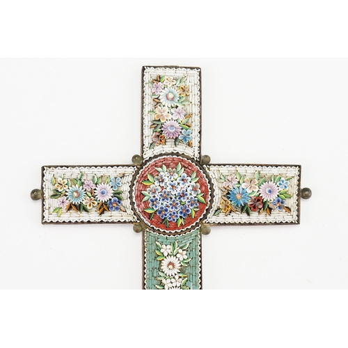 203 - A large Italian Iron mounted Cross in Micro Mosaic on a white & green background decorated with garl... 