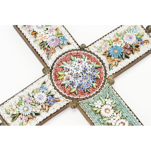 203 - A large Italian Iron mounted Cross in Micro Mosaic on a white & green background decorated with garl... 