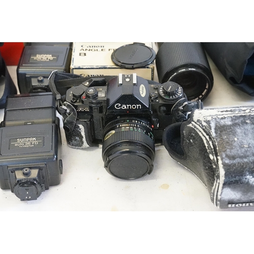 751 - Two Canon Cameras in Original Cases to include 2 x AE1 FD50mm 1.18SC, a Panasonic Mega D1S DMC FZ250... 