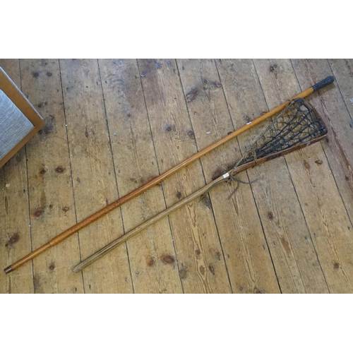 641 - An Antique Elm & Catgut Lacrosse Stick (AF) & a Chinese Silver Coloured White Metal Walking Stick.