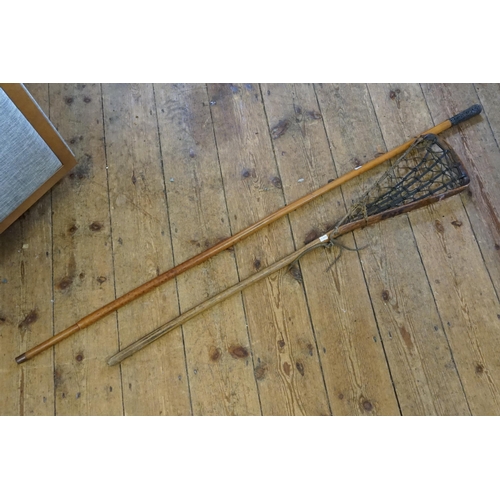 641 - An Antique Elm & Catgut Lacrosse Stick (AF) & a Chinese Silver Coloured White Metal Walking Stick.