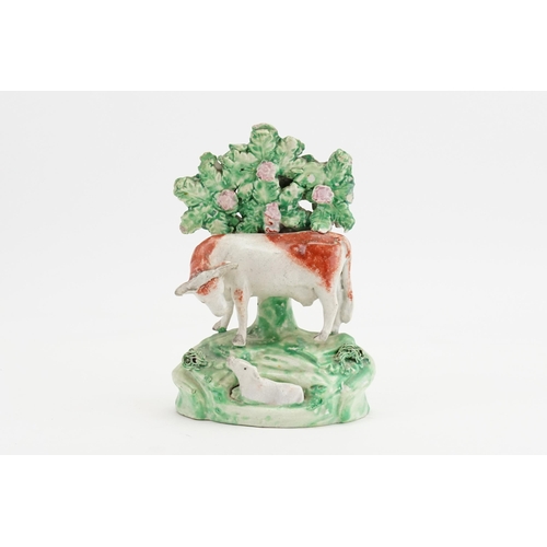 761 - A Ralph Wood design study of a Cow with a Heifer with a floral background. Measuring: 16cms high.