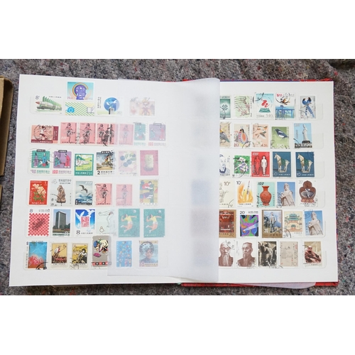 255 - A Collection of Chinese Stamps from various periods contained in a Red Silk Case.