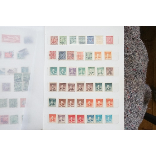 255 - A Collection of Chinese Stamps from various periods contained in a Red Silk Case.