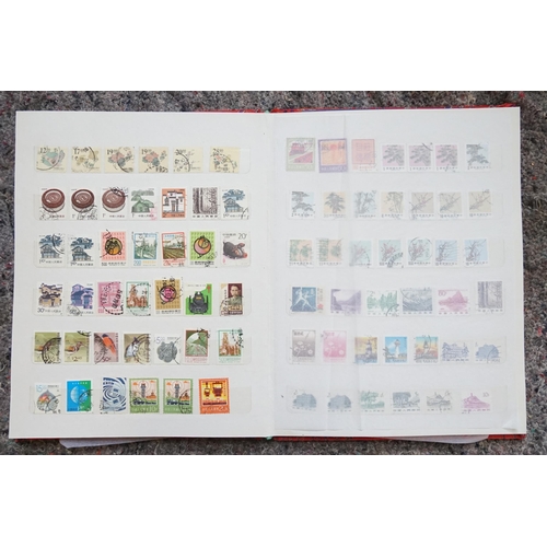 255 - A Collection of Chinese Stamps from various periods contained in a Red Silk Case.