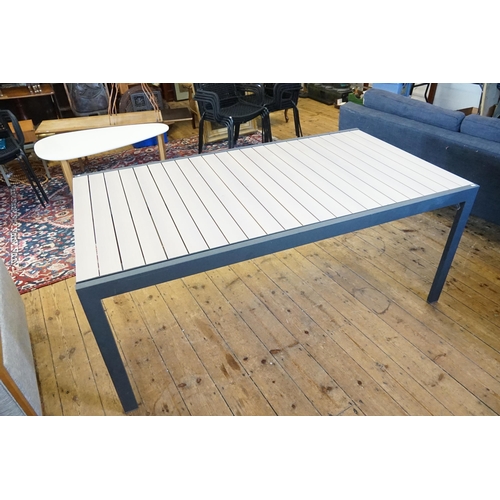 574 - An Extending Grey & Wood Effect Garden Table. Measuring: 268cms Long x 101cms across. (Total Extende... 