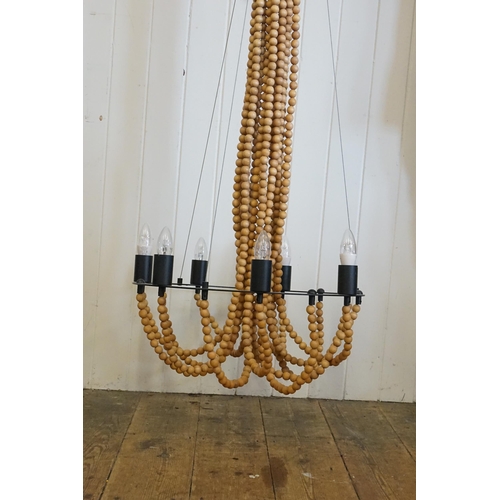 750 - A Large 1960s design Ceiling Light hung with Wooden Beads.