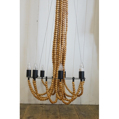 750 - A Large 1960s design Ceiling Light hung with Wooden Beads.