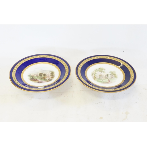 768 - A Pair of Minton design Blue ground Gilt & bordered Jewel decorated Tazza's, hand painted with 19th ... 