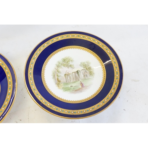 768 - A Pair of Minton design Blue ground Gilt & bordered Jewel decorated Tazza's, hand painted with 19th ... 