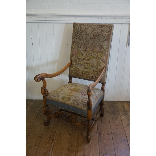 345 - A Carolean 17th Century design armchair with carved and outswept arms with turned and carved legs an... 