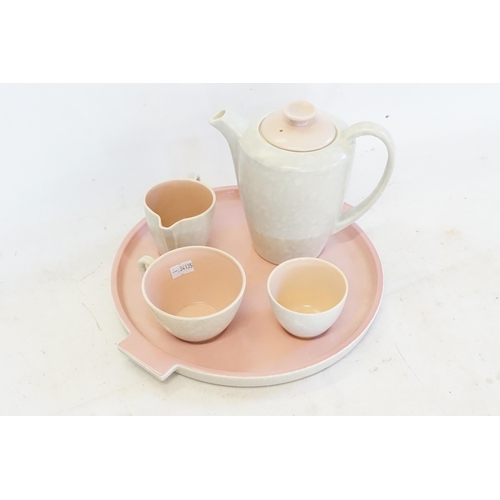 375 - A Poole pottery tea or coffee solitaire set decorated in a two-tone ‘peach bloom and seagull grey’ c... 