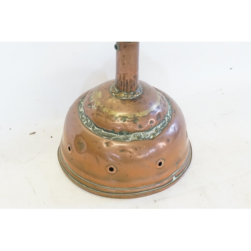 459 - A Copper Washing Dolly with a Wooden Handle.