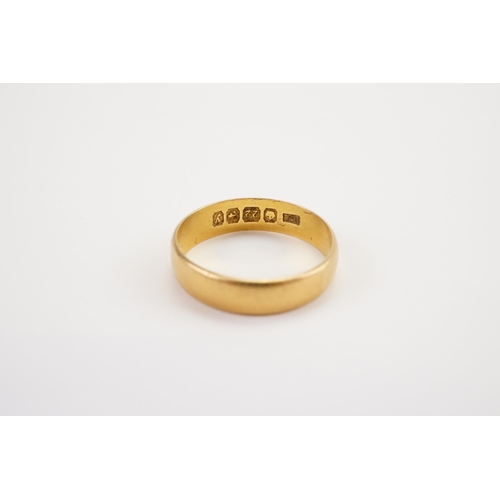 169 - A 22ct Gold Wedding band. Weight 3.4g. Size O.