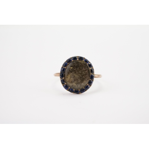 172 - A Blue Stone mounted Mourning Ring, circa 1850s, mounted with 17 sapphires, woven locket of hair. We... 