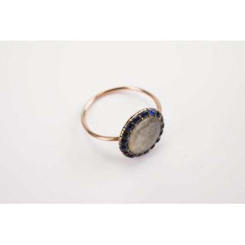 172 - A Blue Stone mounted Mourning Ring, circa 1850s, mounted with 17 sapphires, woven locket of hair. We... 