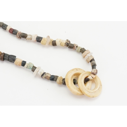 428 - An Ancient Egyptian stone beaded necklace, various stones threaded onto new thread along with Roman ... 