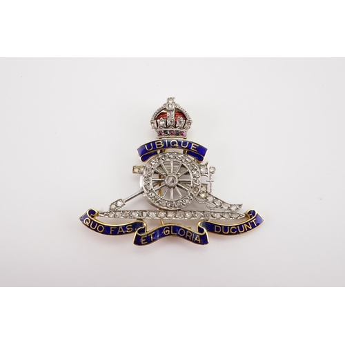 173 - A Royal Artillery Sweetheart brooch set with Diamonds (missing one) and pink & green gems, decorated... 