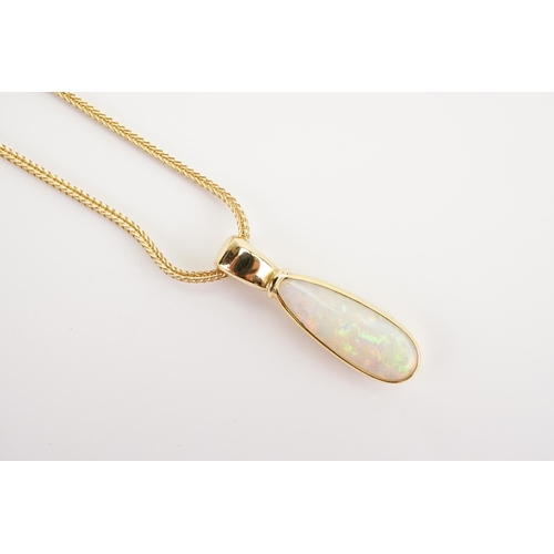 174 - A large Tear Drop Opal in an 18ct Gold setting (2.2g), hung on a 14ct Gold chain (4g).