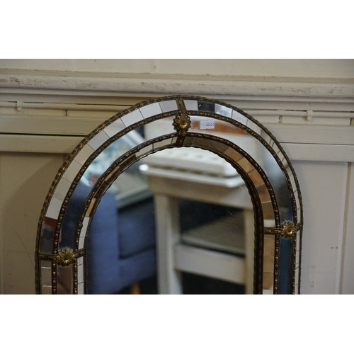 560 - A Reproduction Continental Oval Topped Cheval Mirror made from various glass fragments. Measuring: 1... 