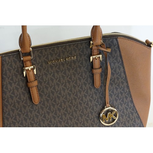 654 - A Michael Kors brown leather handbag, with the MK monogram.