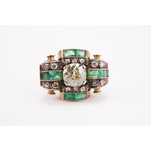 175D - A antique art deco diamond and emerald set ring, set with a approx 2ct round cut possible fancy yell... 