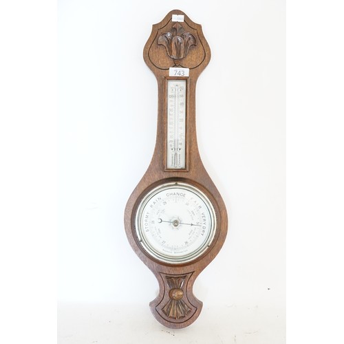 743 - An Edwardian Oak Banjo Barometer with Nickel Silver Dial. Measuring: 59cms High.