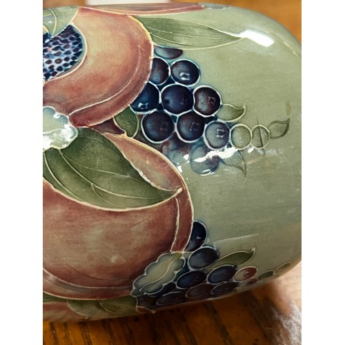 432 - A William Moorcroft pottery pomegranate vase, for Liberty & Co circa 1905. Decorated in blue, green ... 