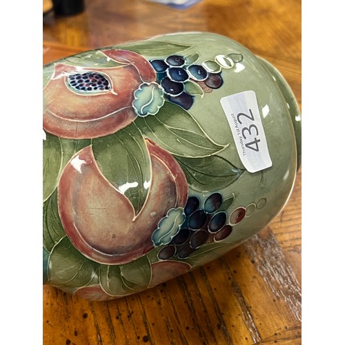 432 - A William Moorcroft pottery pomegranate vase, for Liberty & Co circa 1905. Decorated in blue, green ... 