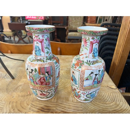 298 - A Pair of Chinese Cantonese enamelled Vases decorated with Court scenes. Measuring: 23cms high. Alon... 