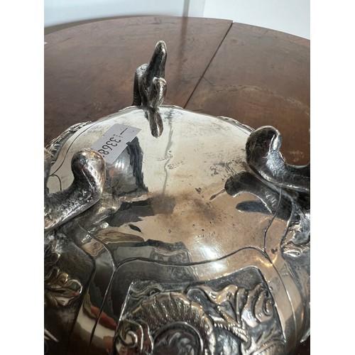 14 - A Chinese Export Silver Dragon bowl, circa 1900s, decorated with dragons and scenes. Seal mark to ba... 