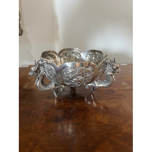 14 - A Chinese Export Silver Dragon bowl, circa 1900s, decorated with dragons and scenes. Seal mark to ba... 