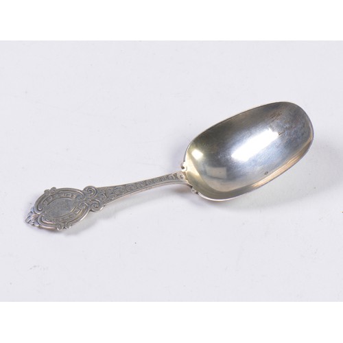 57 - A Silver Long Handled Caddy Spoon with engraved decoration, armorial crest by George Unite. Birmingh... 