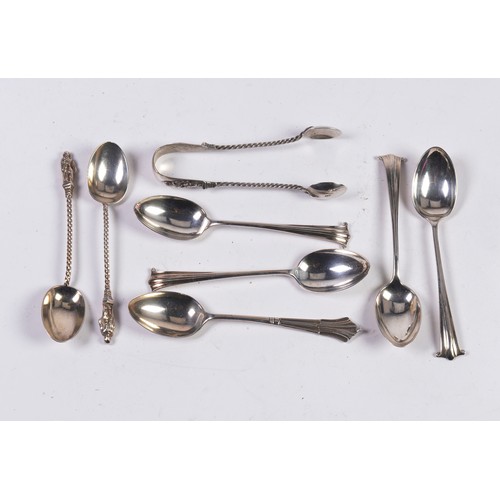 58 - Seven Various Silver Teaspoons & a Pair of Silver Sugar Tongs. Weighing: 90 grams.