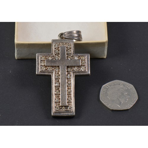 106 - A 925 Silver Cross inset with Paste Stones. Weighing: 39 grams.