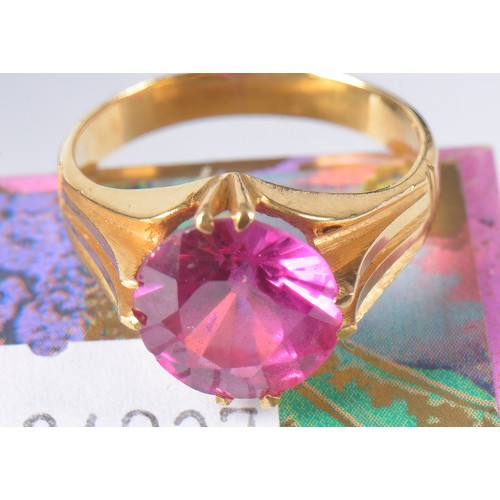 111 - A Ladies Gold Ring set with a Pink Spinel.