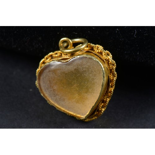 115 - A Victorian Heart Shaped Locket inset with Turquoise with an Opening Back.