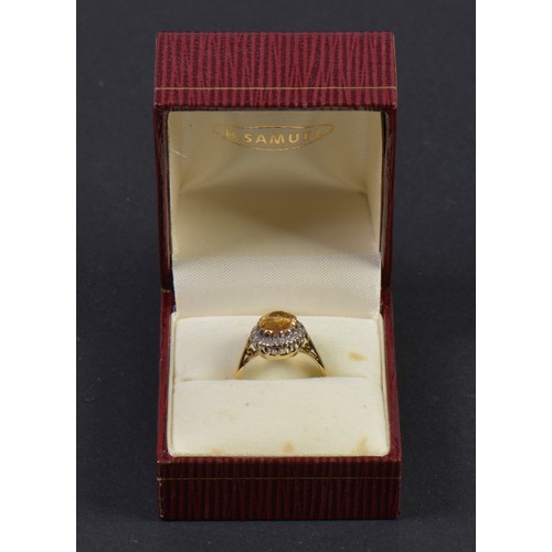 147 - A Ladies 18ct Gold Ring set with a Citrine in a Cluster of Diamonds. Weighing: 3.8 grams. Size: L.