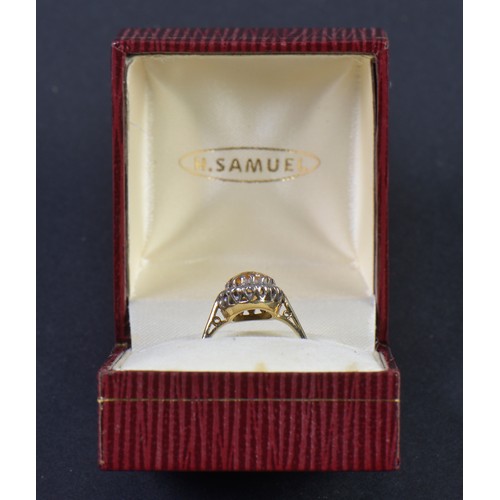 147 - A Ladies 18ct Gold Ring set with a Citrine in a Cluster of Diamonds. Weighing: 3.8 grams. Size: L.