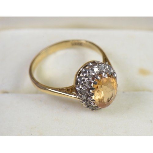 147 - A Ladies 18ct Gold Ring set with a Citrine in a Cluster of Diamonds. Weighing: 3.8 grams. Size: L.