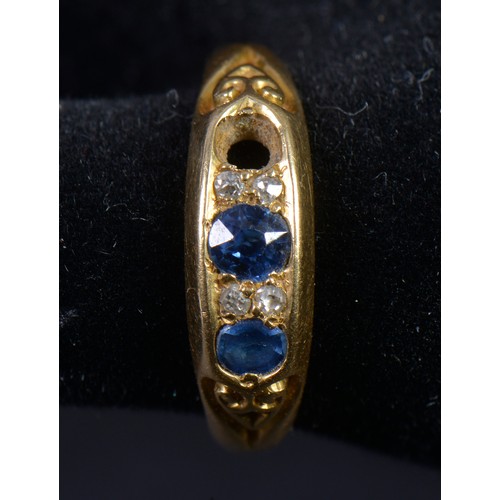 152 - An 18ct Gold Ring set with Sapphires & Diamond Chips. Weighing: 3.7 grams. Size: P/Q.