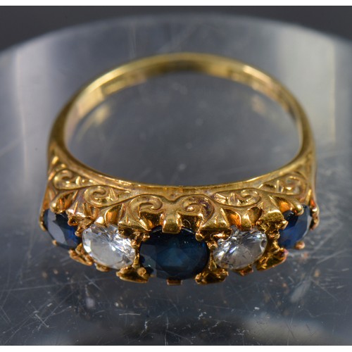 153 - An 18ct Sapphire & Diamond Ladies Dress Ring mounted in a Claw setting with engraved shoulders. Weig... 