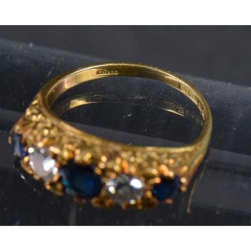 153 - An 18ct Sapphire & Diamond Ladies Dress Ring mounted in a Claw setting with engraved shoulders. Weig... 