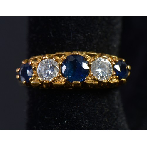 153 - An 18ct Sapphire & Diamond Ladies Dress Ring mounted in a Claw setting with engraved shoulders. Weig... 