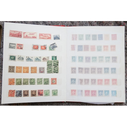 255 - A Collection of Chinese Stamps from various periods contained in a Red Silk Case.