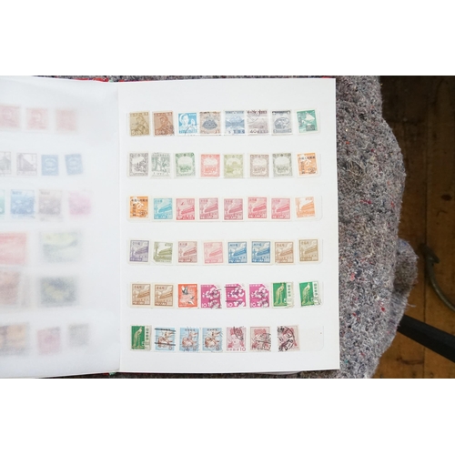 255 - A Collection of Chinese Stamps from various periods contained in a Red Silk Case.