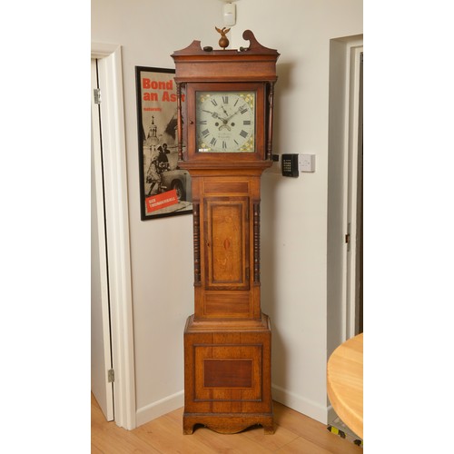 279 - An Antique Oak Cased Grandfather Clock with turned Pillars, Cross Banded & inlaid Front & resting on... 