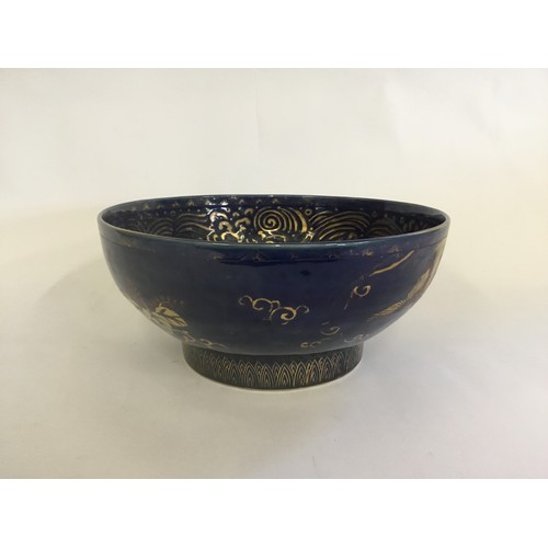 309 - A Chinese Powder Blue Ground Punch Bowl decorated with the interior in Gold of Waves & Swirls, exter... 