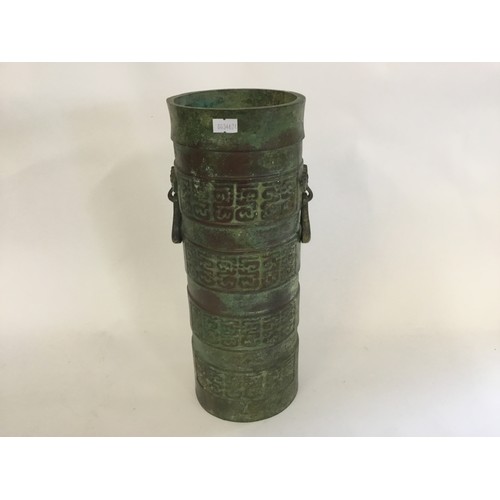 313 - A Tang Style Two Handled Waring States Cast Bronze Cannon Shot Carrier. Measuring: 37cms high.